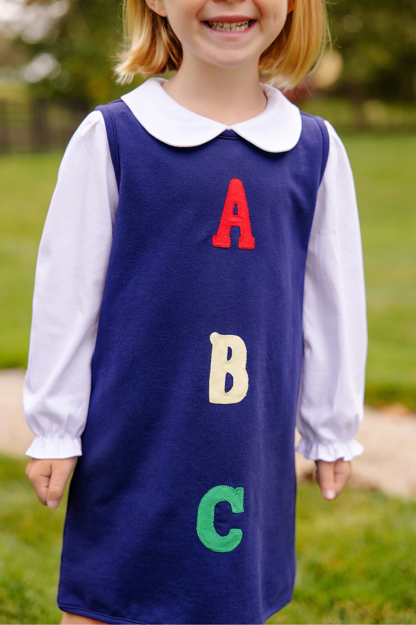 The Beaufort Bonnet Company Annie Apron Dress - Nantucket Navy with ABC applique